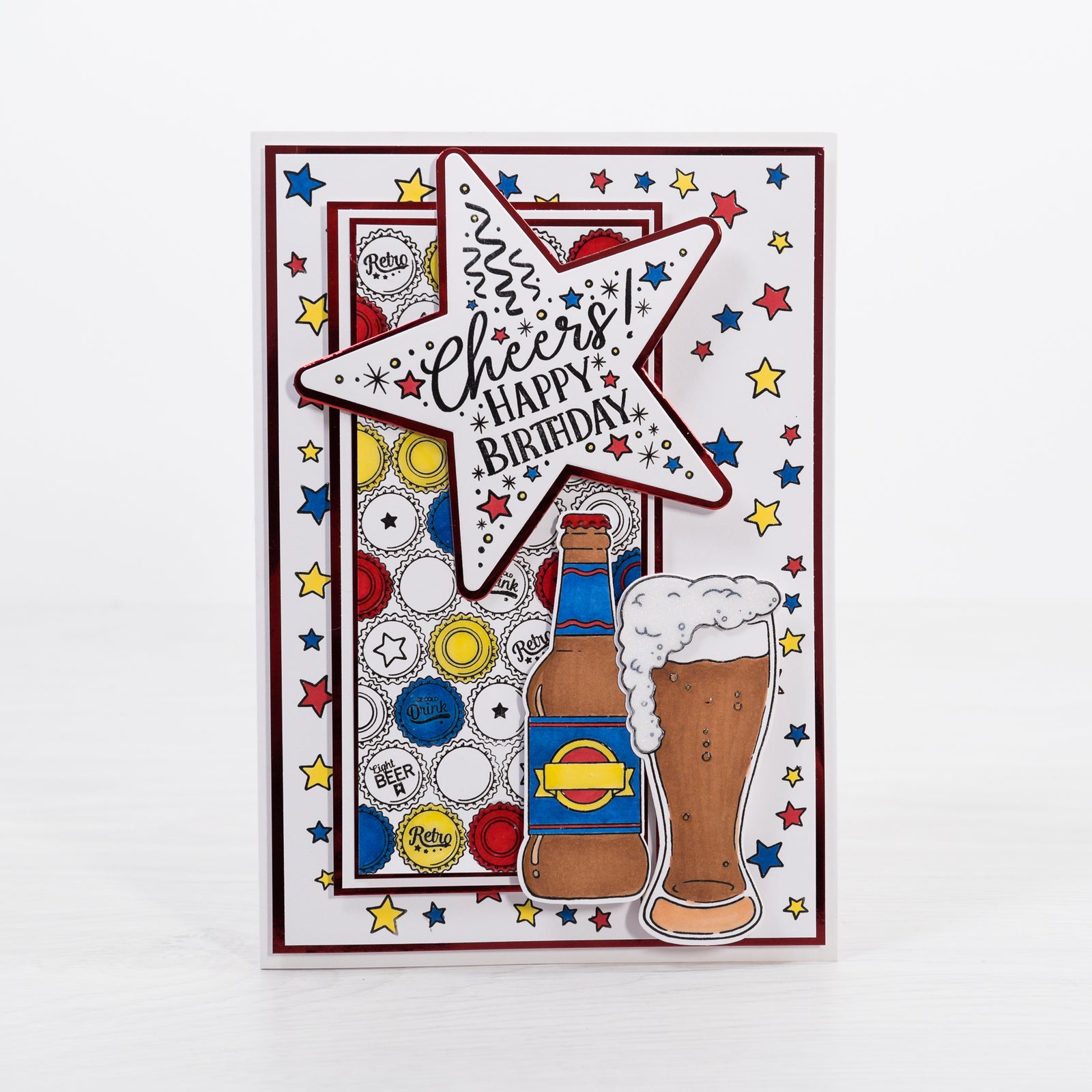 Learn how to make this colourful Birthday Beer greetings card with a beer cap background stamped print using our new stamps and card making dies from Chloes Creative Cards.